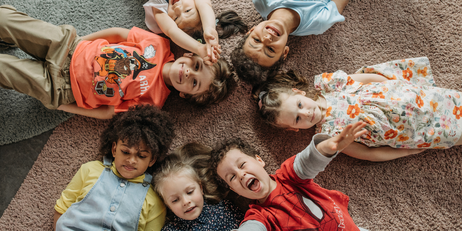 A group of children lying on the ground