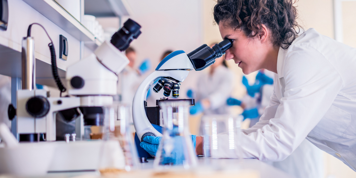 Doctor looking into a microscope