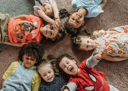 A group of children lying on the ground