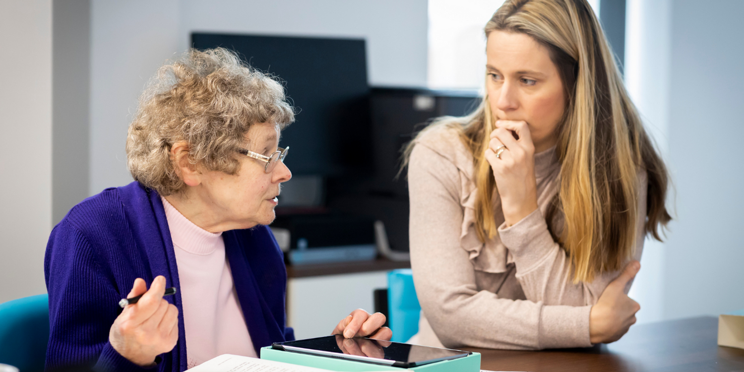 Old Woman Speaking to Young Woman